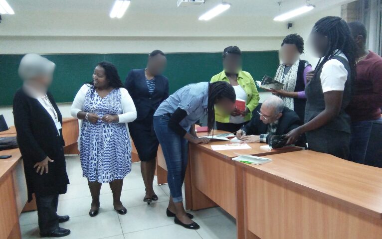 The late Pheroze Nowrojee autographing his book for Coffee with Aristotle members